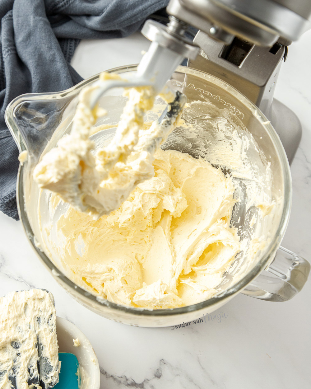 A standmixer bowl filled with whipped buttercream.