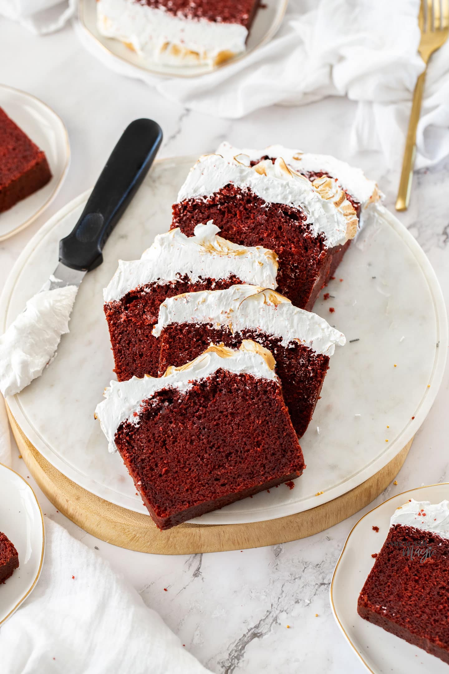 Slices of red velvet pound cake on a white platter