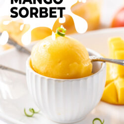 A white bowl with a big scoop of mango sorbet