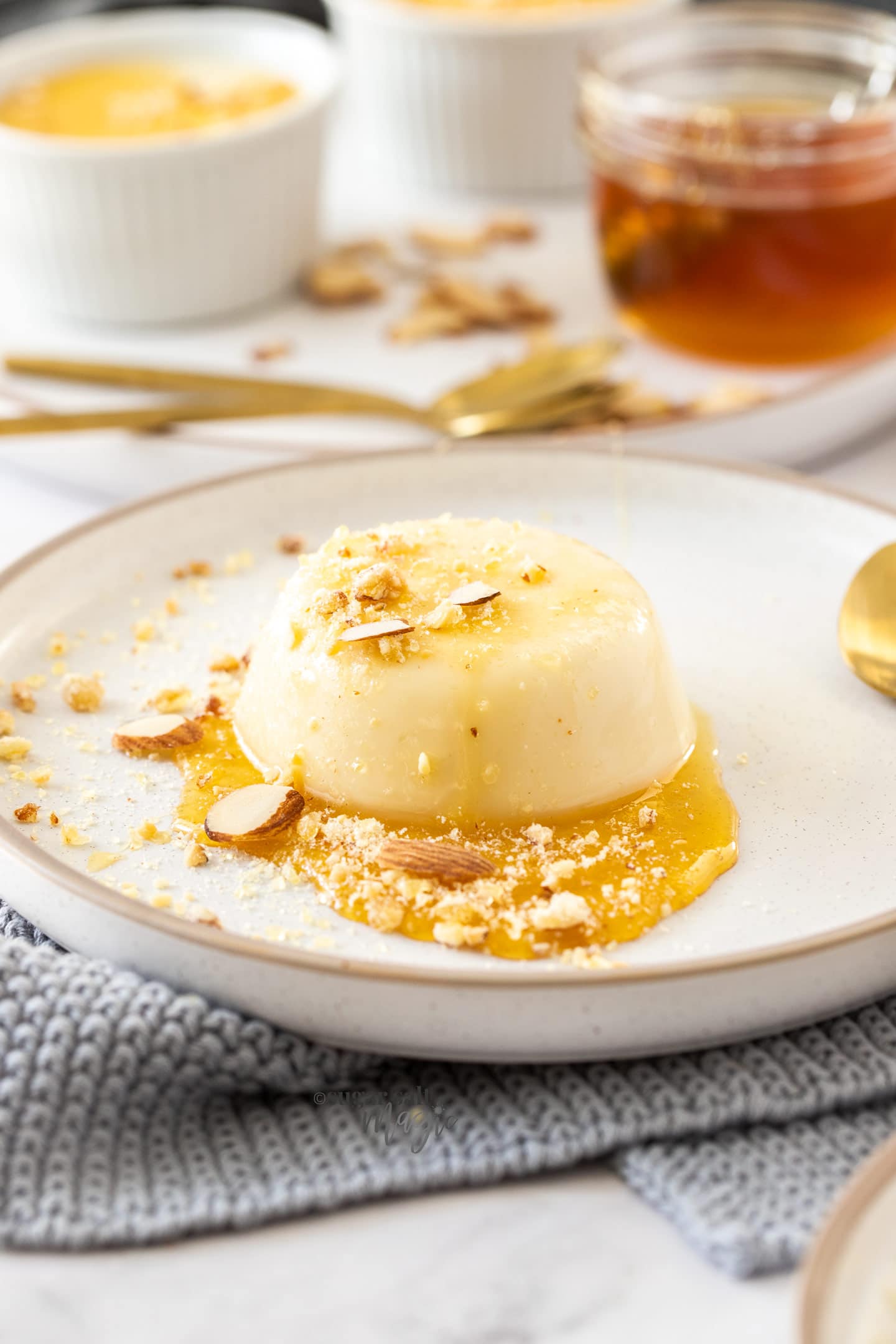 Panna cotta with honey on a plate.