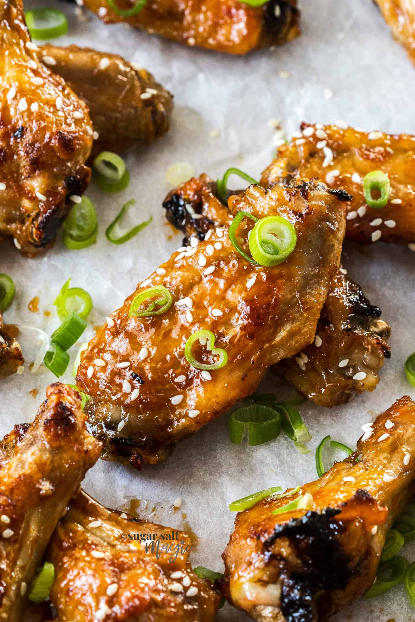 Closeup of a sticky chicken wing.