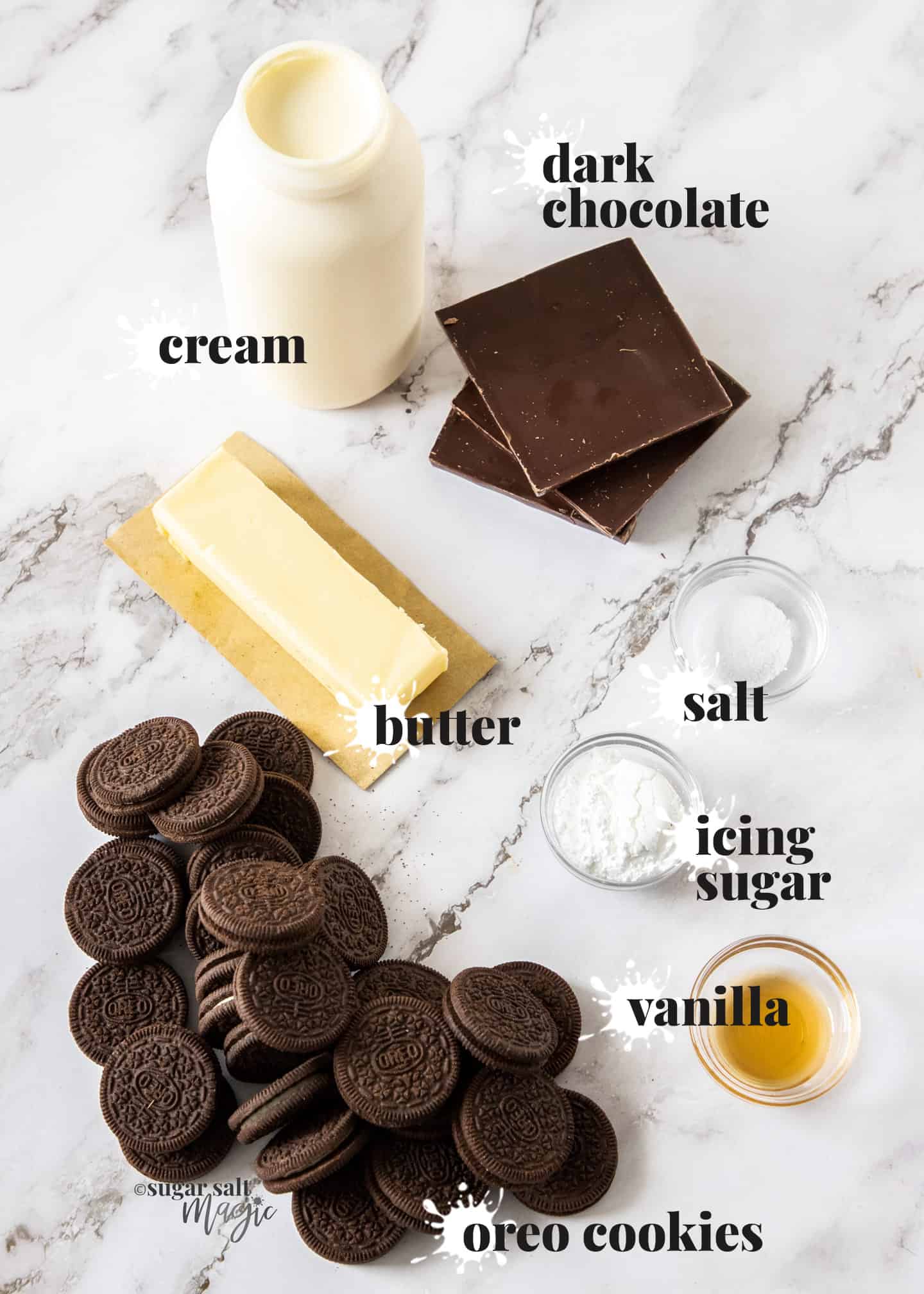 Ingredients required for chocolate mousse tart laid out on a marble surface.