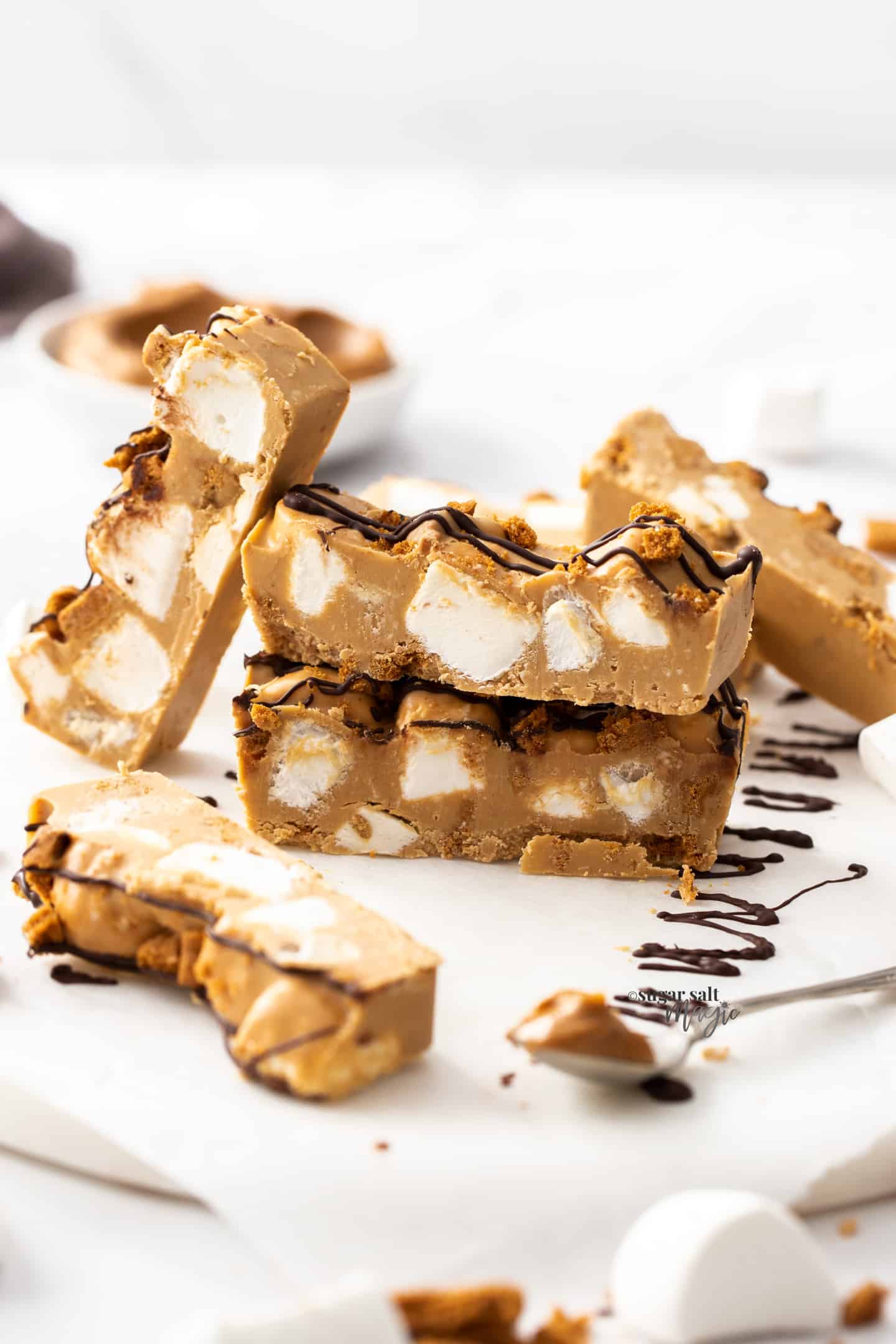Pieces of biscoff rocky road stacked against each other.
