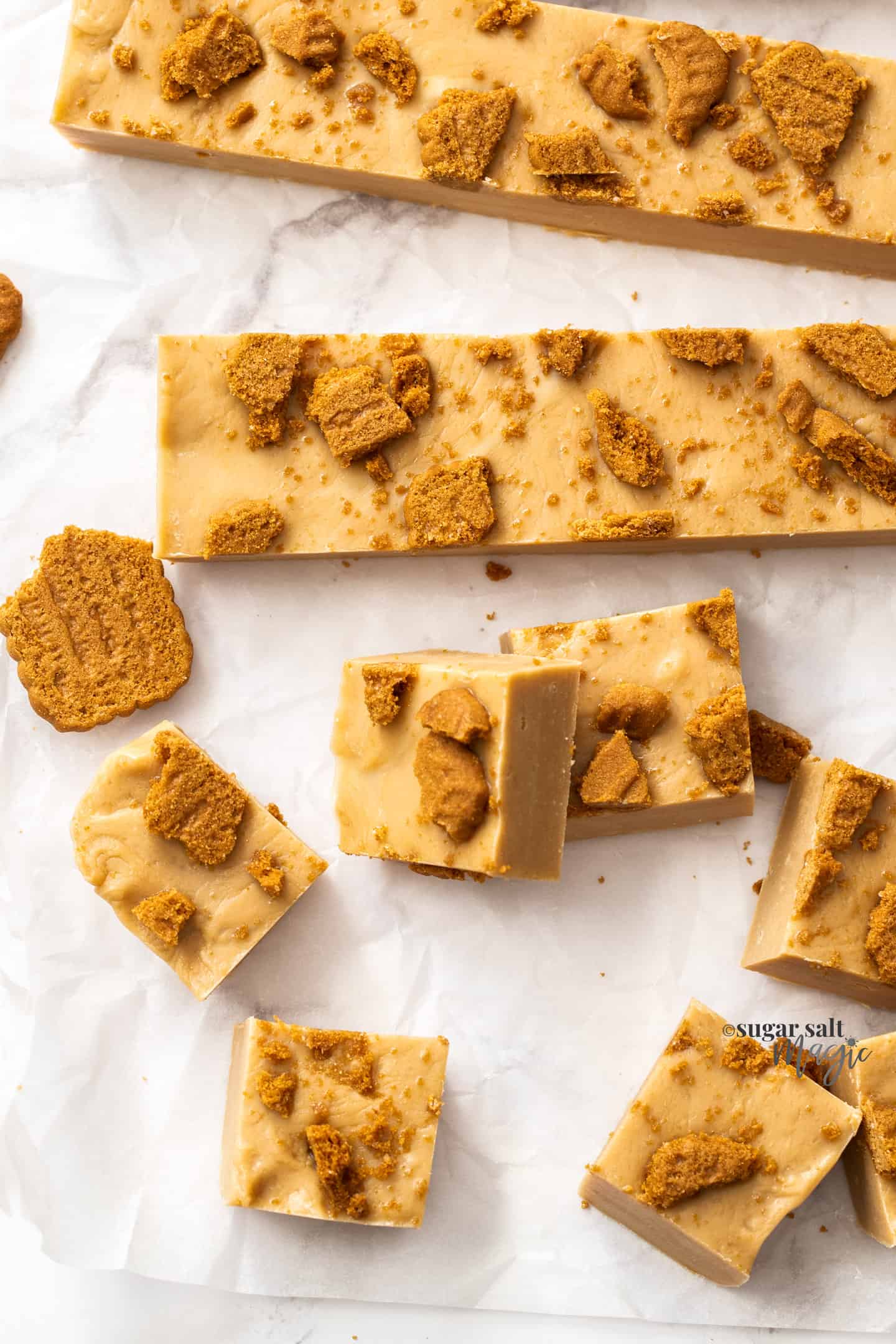 Top down view of biscoff fudge in squares and sticks.