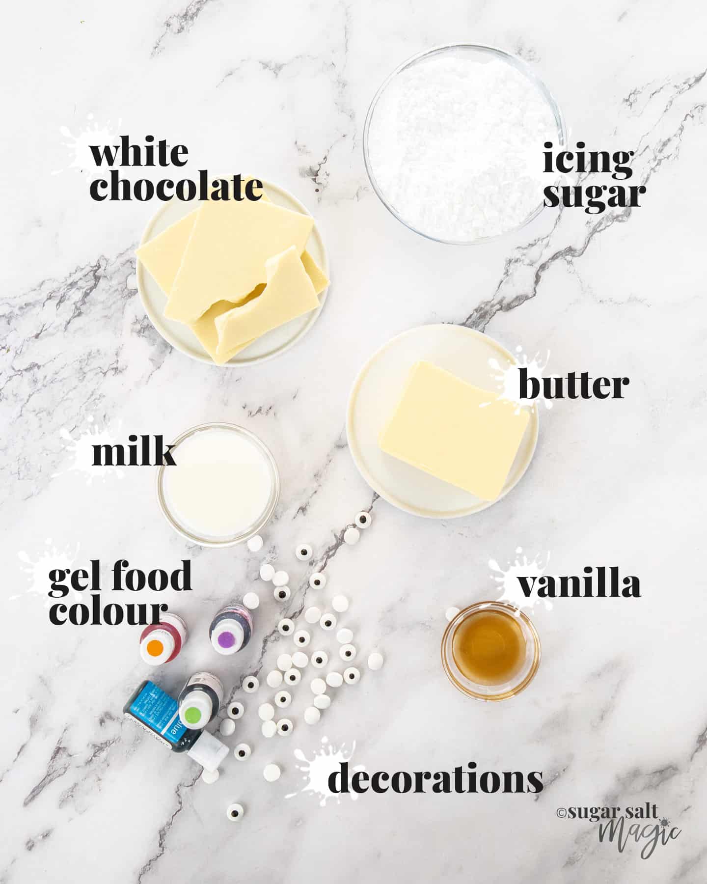 Ingredients for whipped white chocolate buttercream on a marble surface.