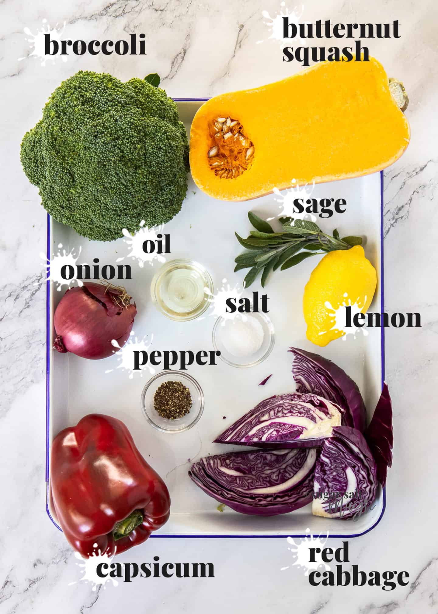 Ingredients for vegetable tray bake on a sheet pan.