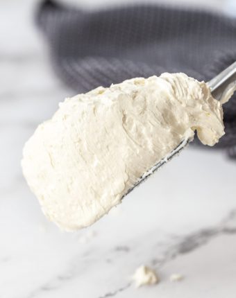 A spatula loaded with Swiss meringue buttercream.