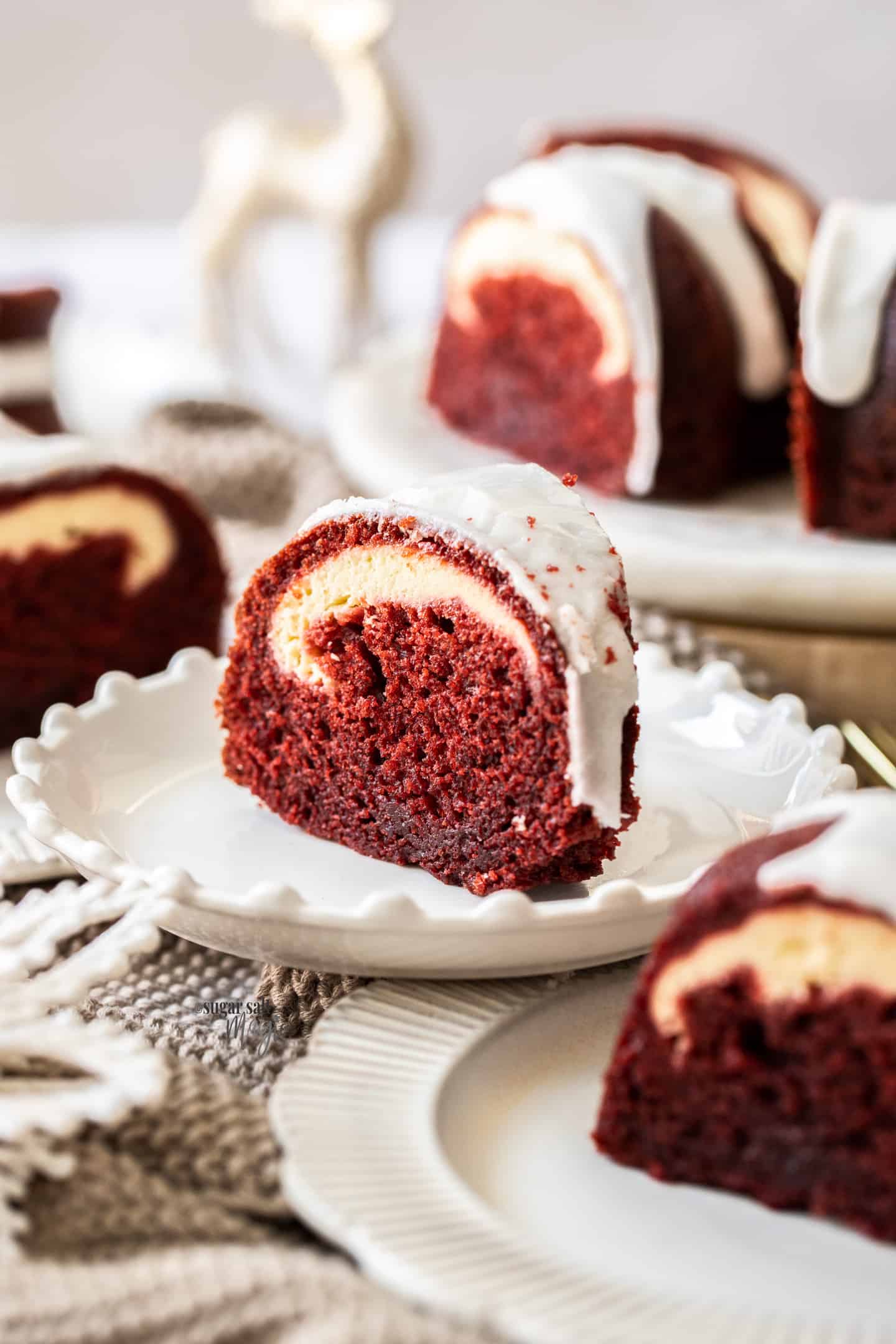 A slice of red velvet bundt cake on a white plate.