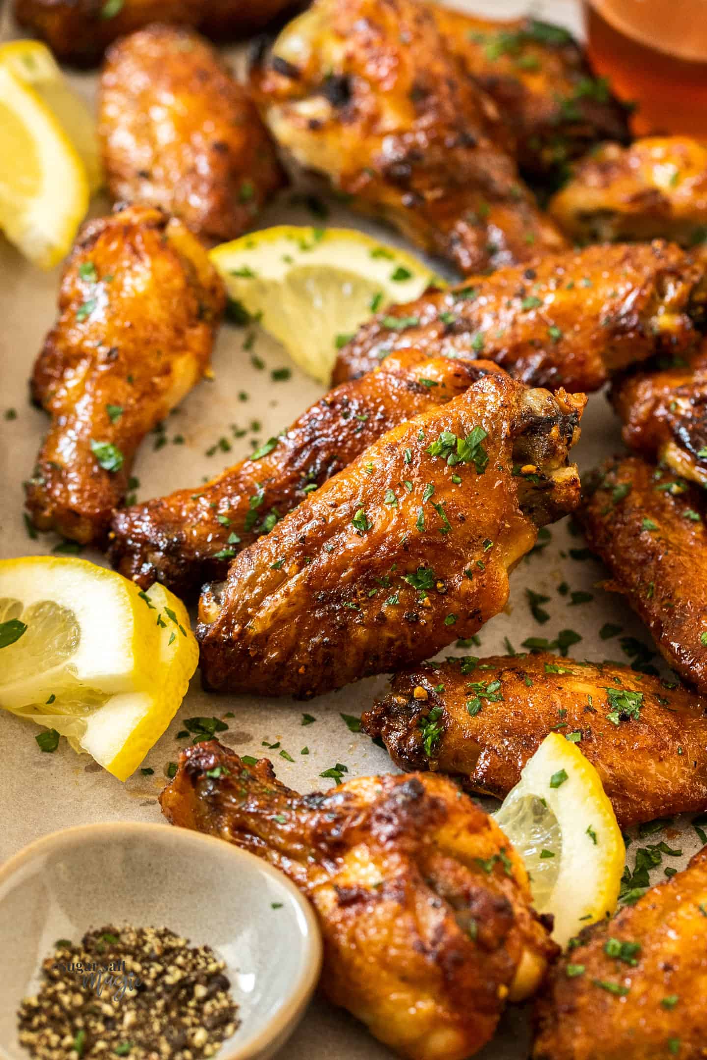Close up of baked golden chicken wings.