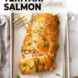 A large piece of salmon on a baking tray.