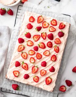 Top down view of a strawberry sheet cake.