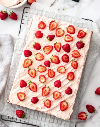 Top down view of a strawberry sheet cake.