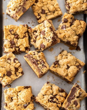 Chocolate chip nutella bars, some face up, some on their sides, on a pewter tray.