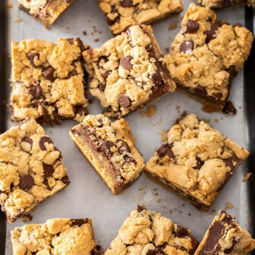 Chocolate chip nutella bars, some face up, some on their sides, on a pewter tray.