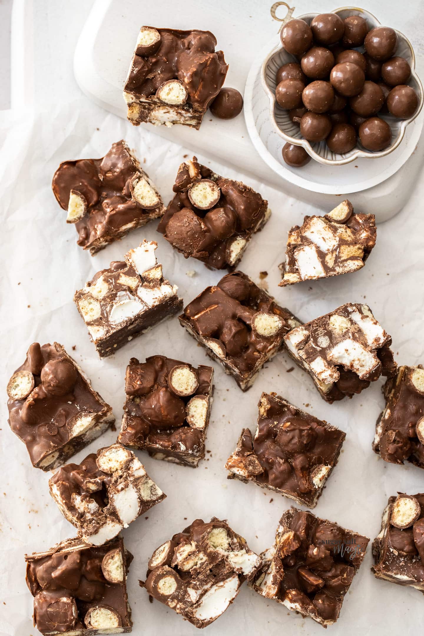 Top down view of cut up Malteser rocky road, showing the inside.