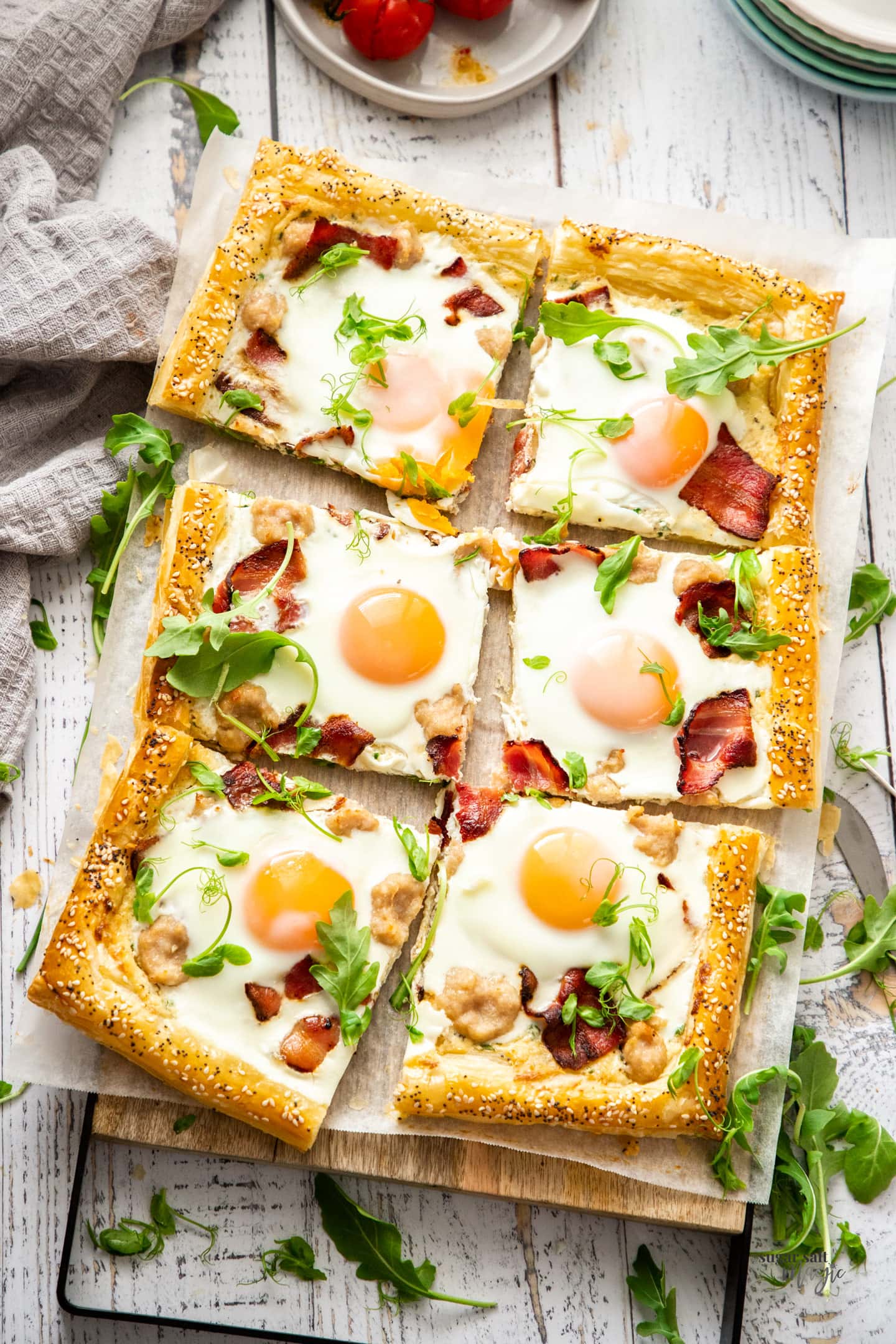 Top down view of a breakfast tart sliced into 6 pieces.