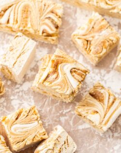 A batch of caramel marshmallow squares on a sheet of baking paper.