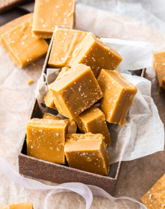 A box full of salted caramel fudge squares.