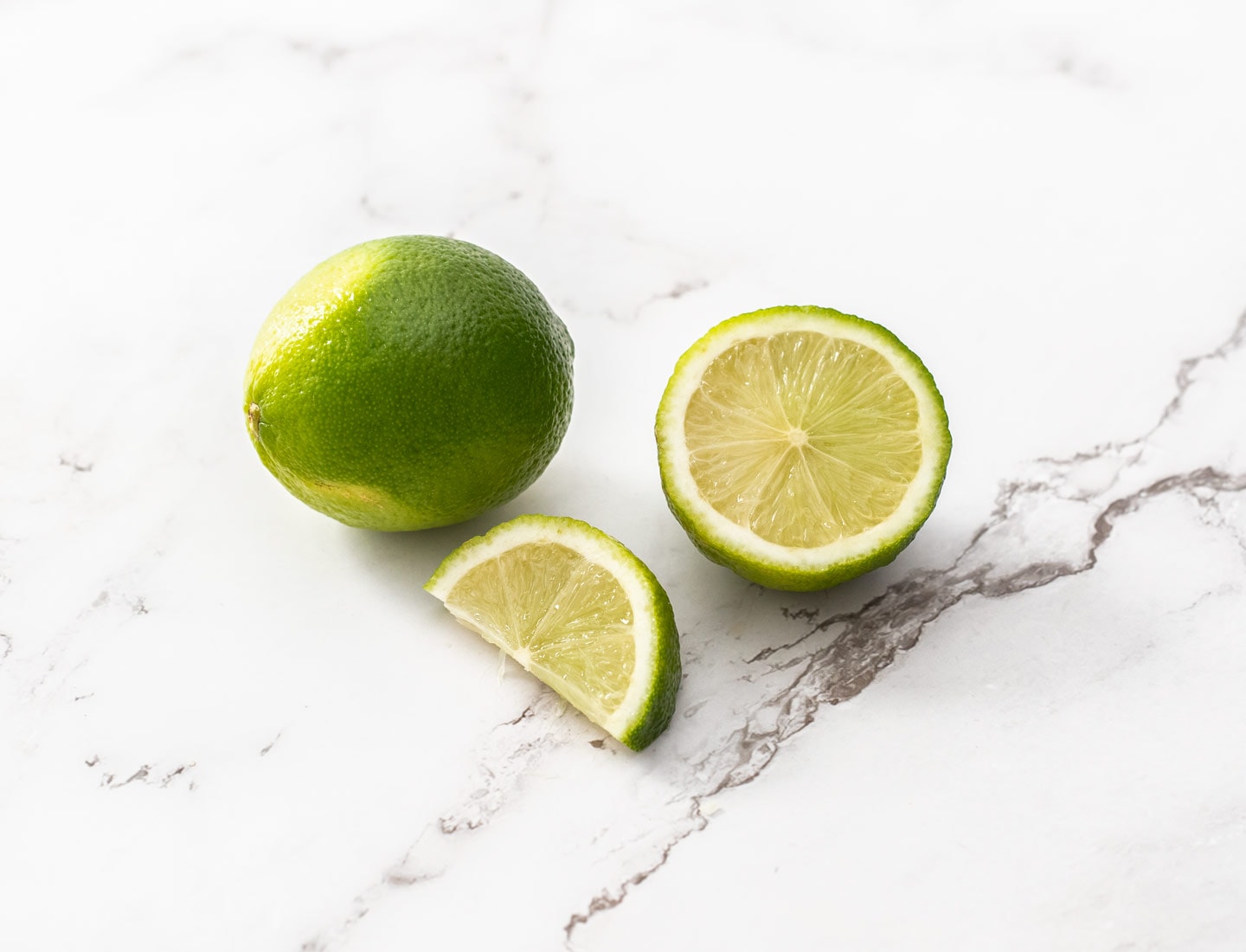 Limes on a marble surface.