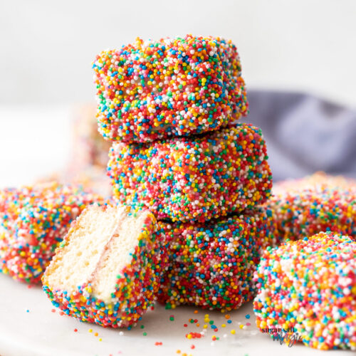 A stack of 3 fairy bread lamingtons.