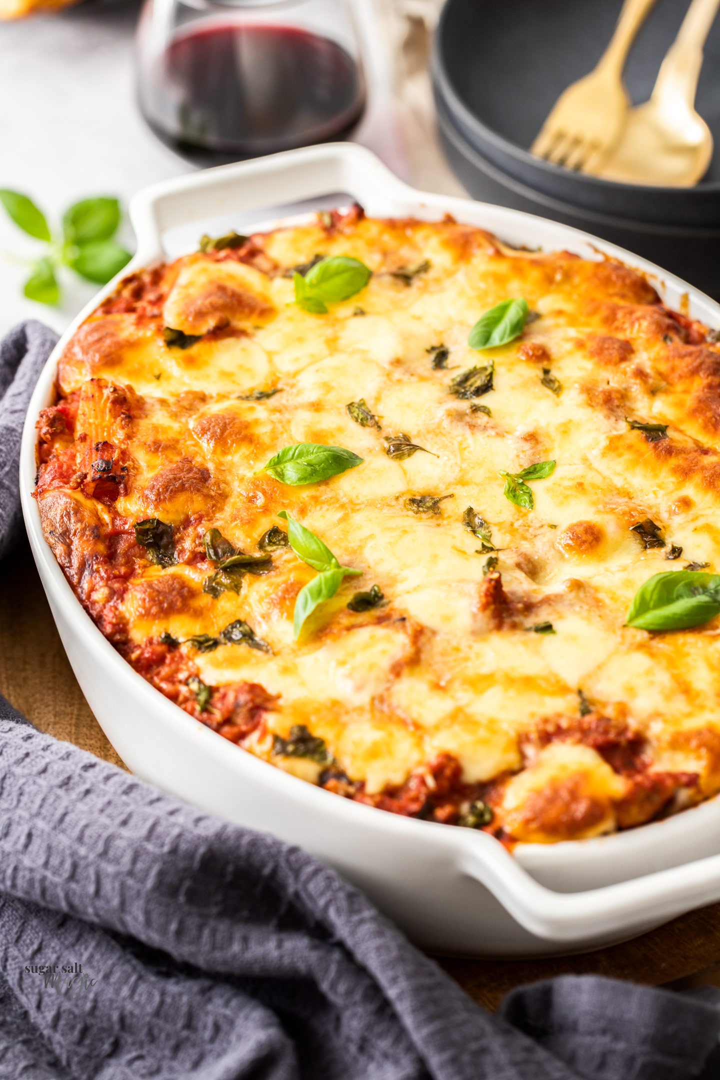 A casserole dish filled with baked rigatoni al forno.