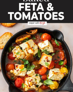 A cast iron skillet filled with baked feta and tomatoes.