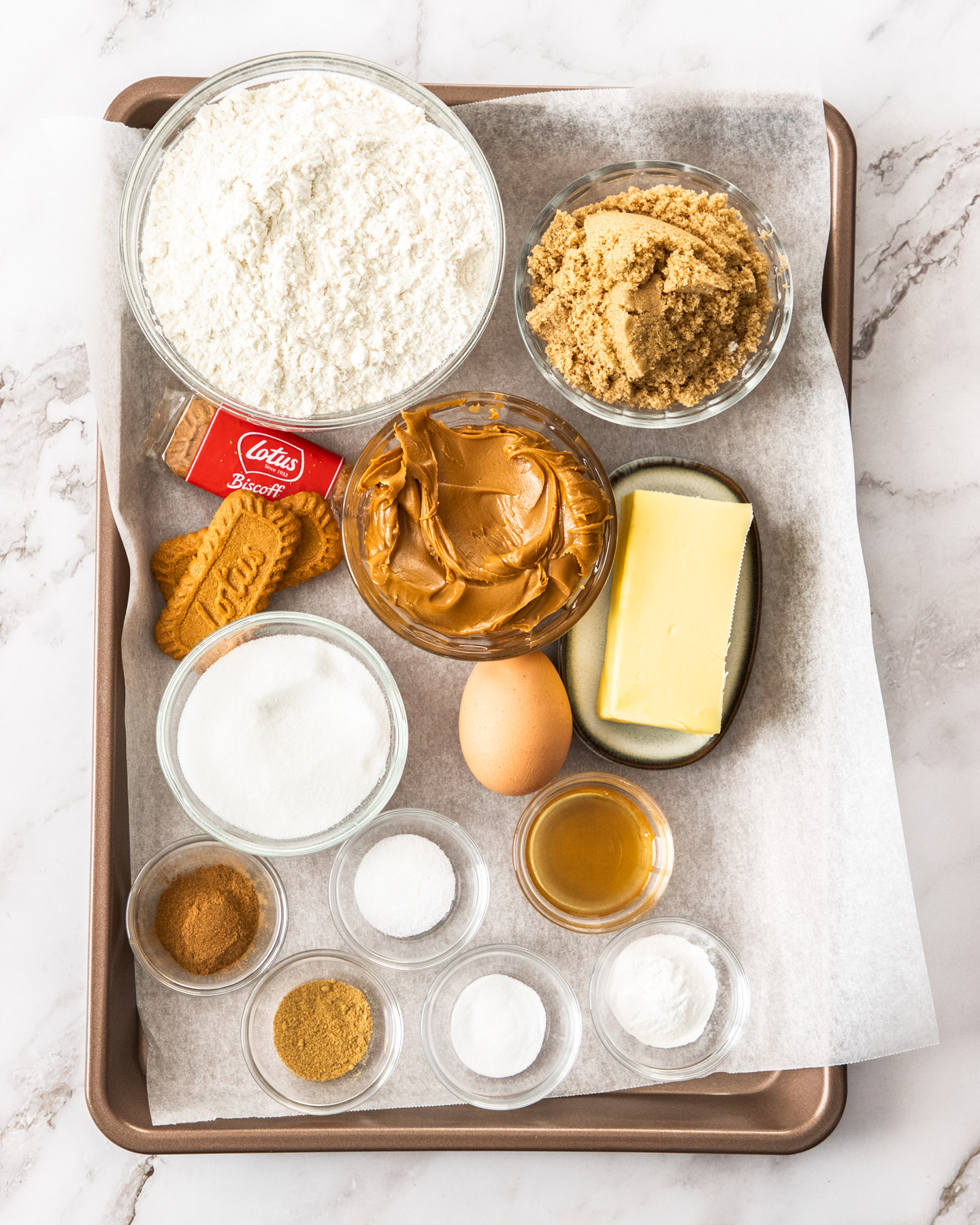 Ingredients for Biscoff butter cookies on a baking tray.