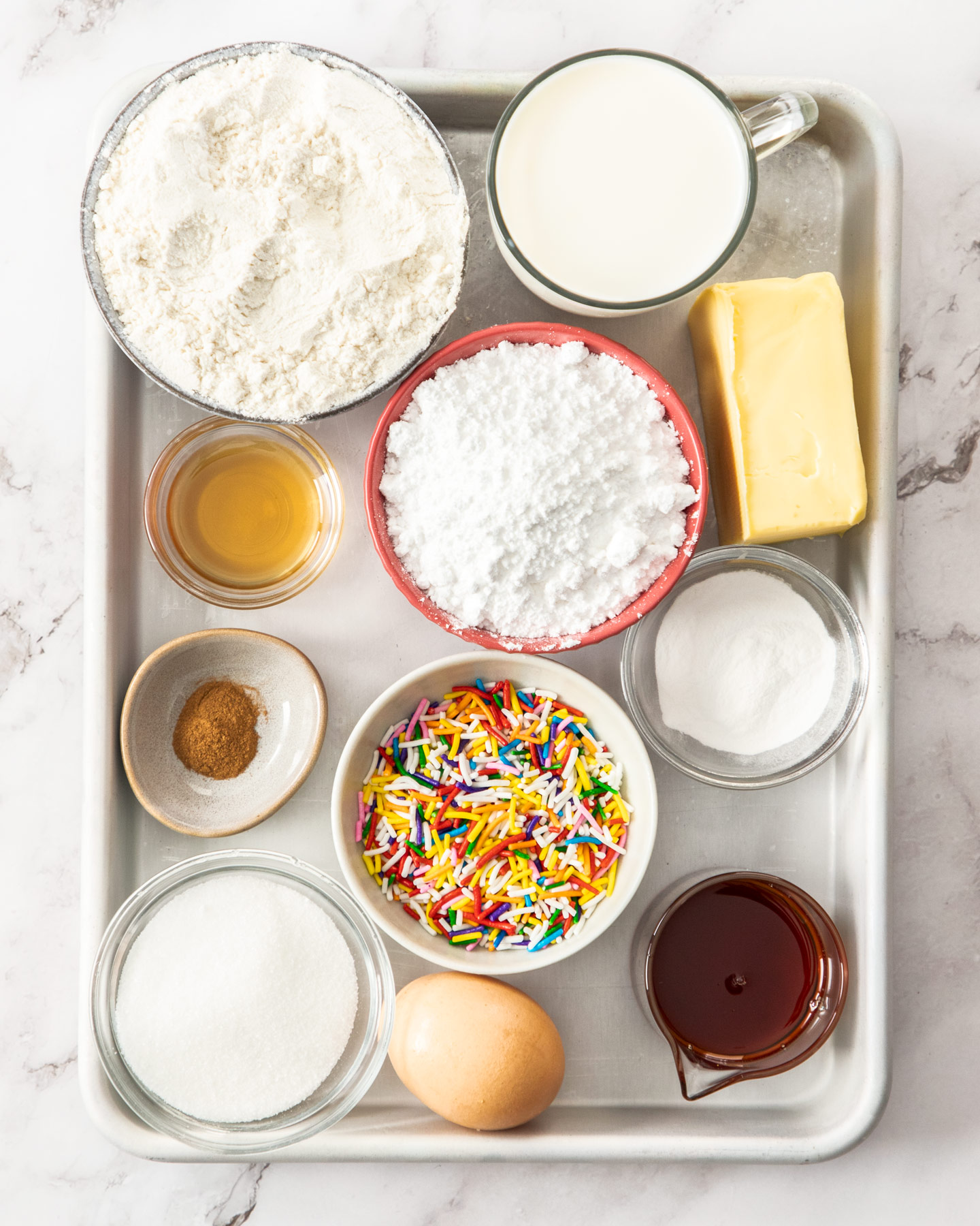 Ingredients for funfetti pancakes on a baking tray.