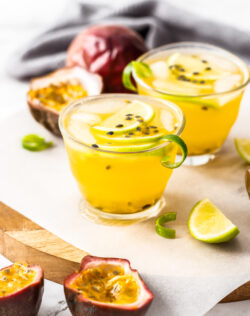 Passionfruit cocktails with curls of lime zest.