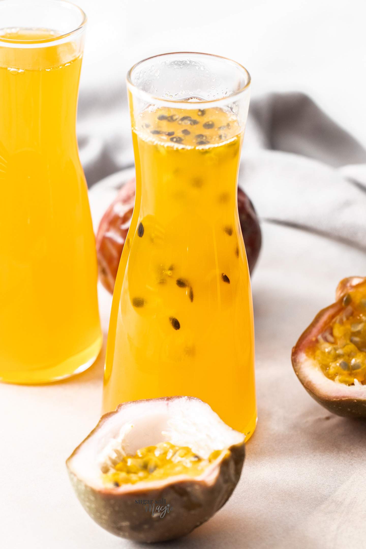 Closeup of a bottle of passionfruit syrup.