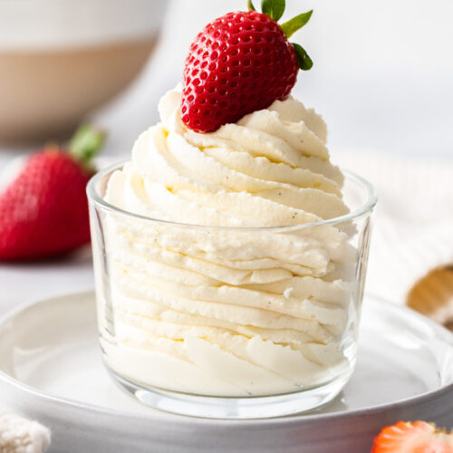 Chantilly cream piped in a swirl in a glass.