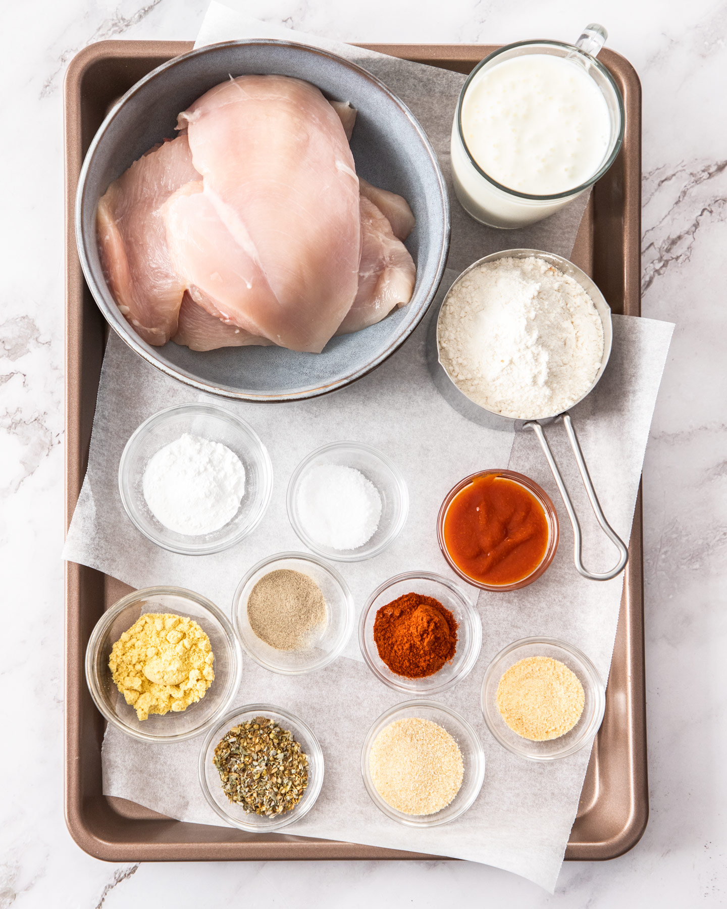Ingredients for buttermilk fried chicken breasts.
