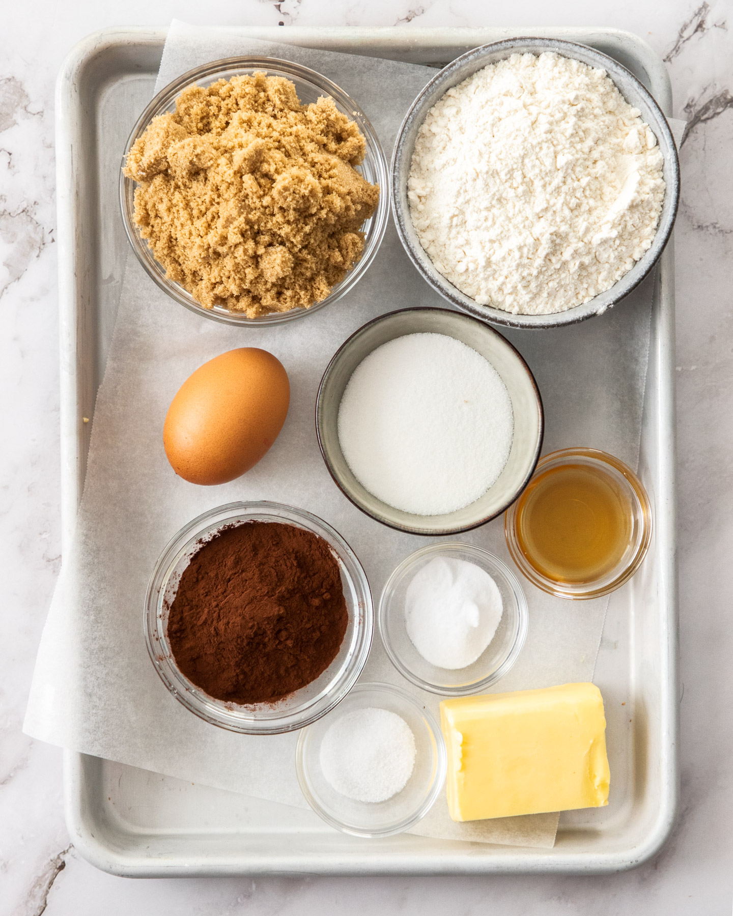 Ingredients for marble cookies on a baking tray.