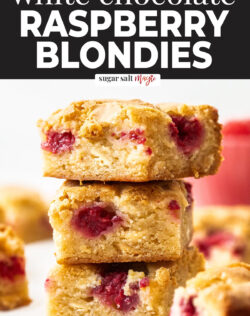 A stack of 3 blondies filled with raspberries.
