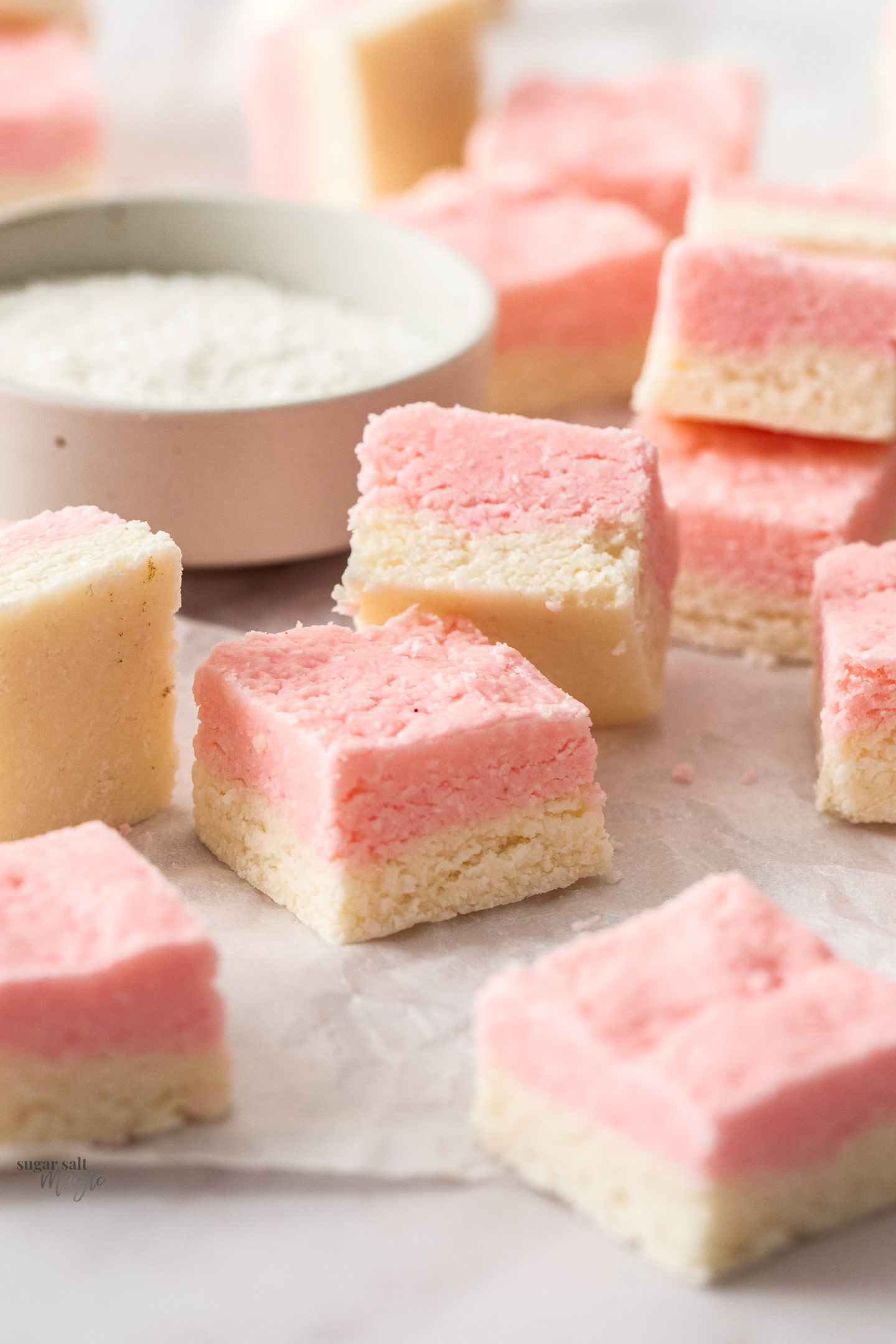 Closeup of squares of coconut ice.