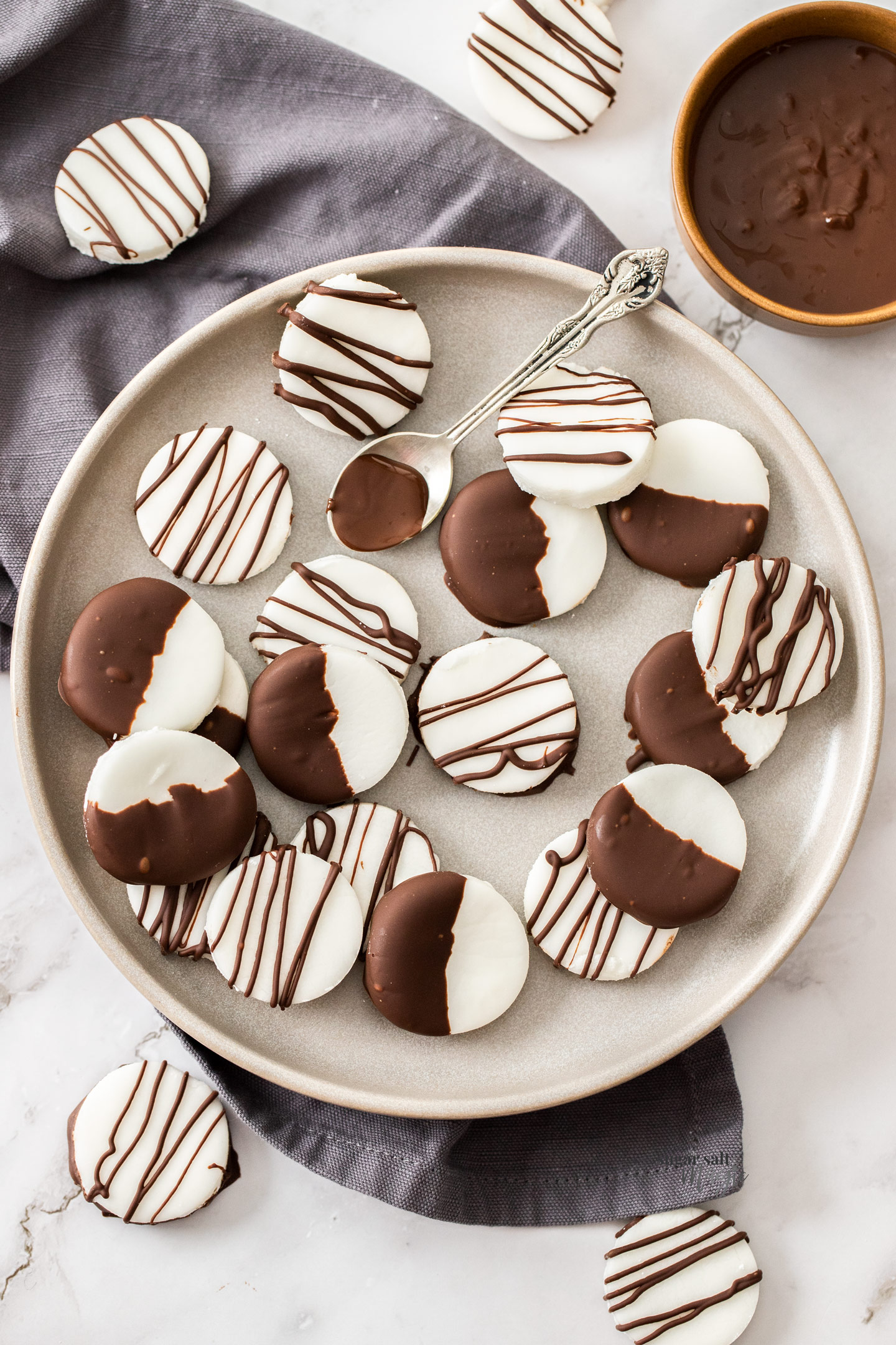 Top down view of peppermint creams on a plate.