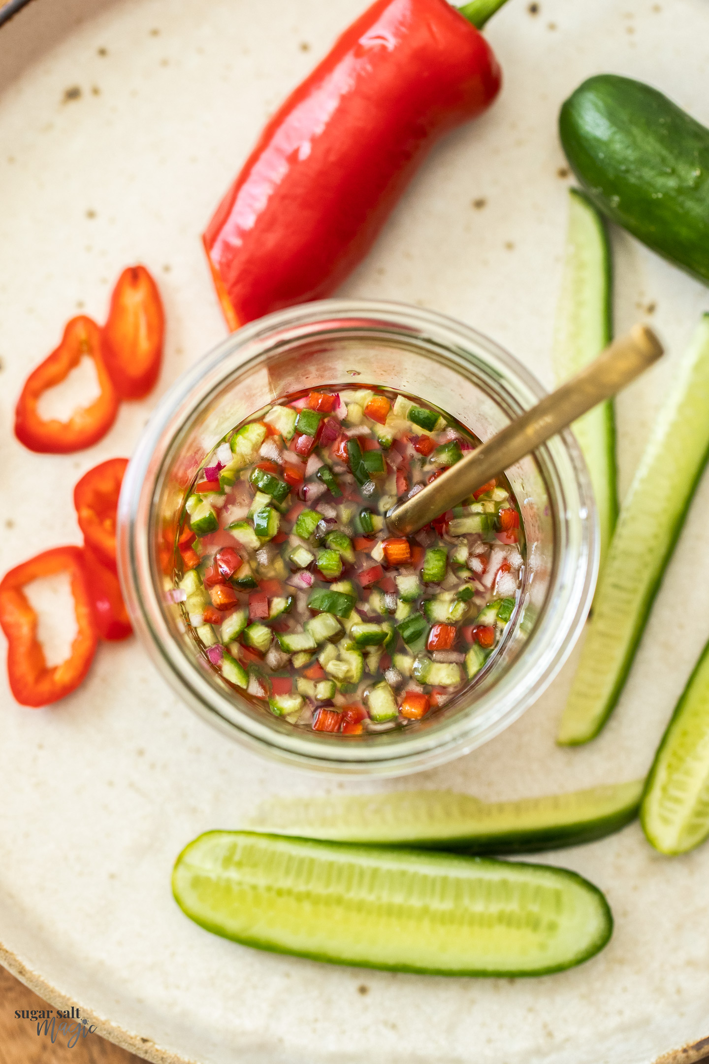 Top down view of a jar of Thai cucumber relish.