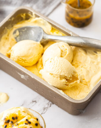 Passionfruit ice cream in a loaf pan.