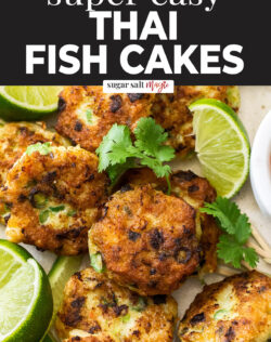 Close up of Thai fish cakes with lime wedges.