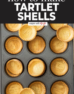 A batch of mini tart shells in a muffin tin.