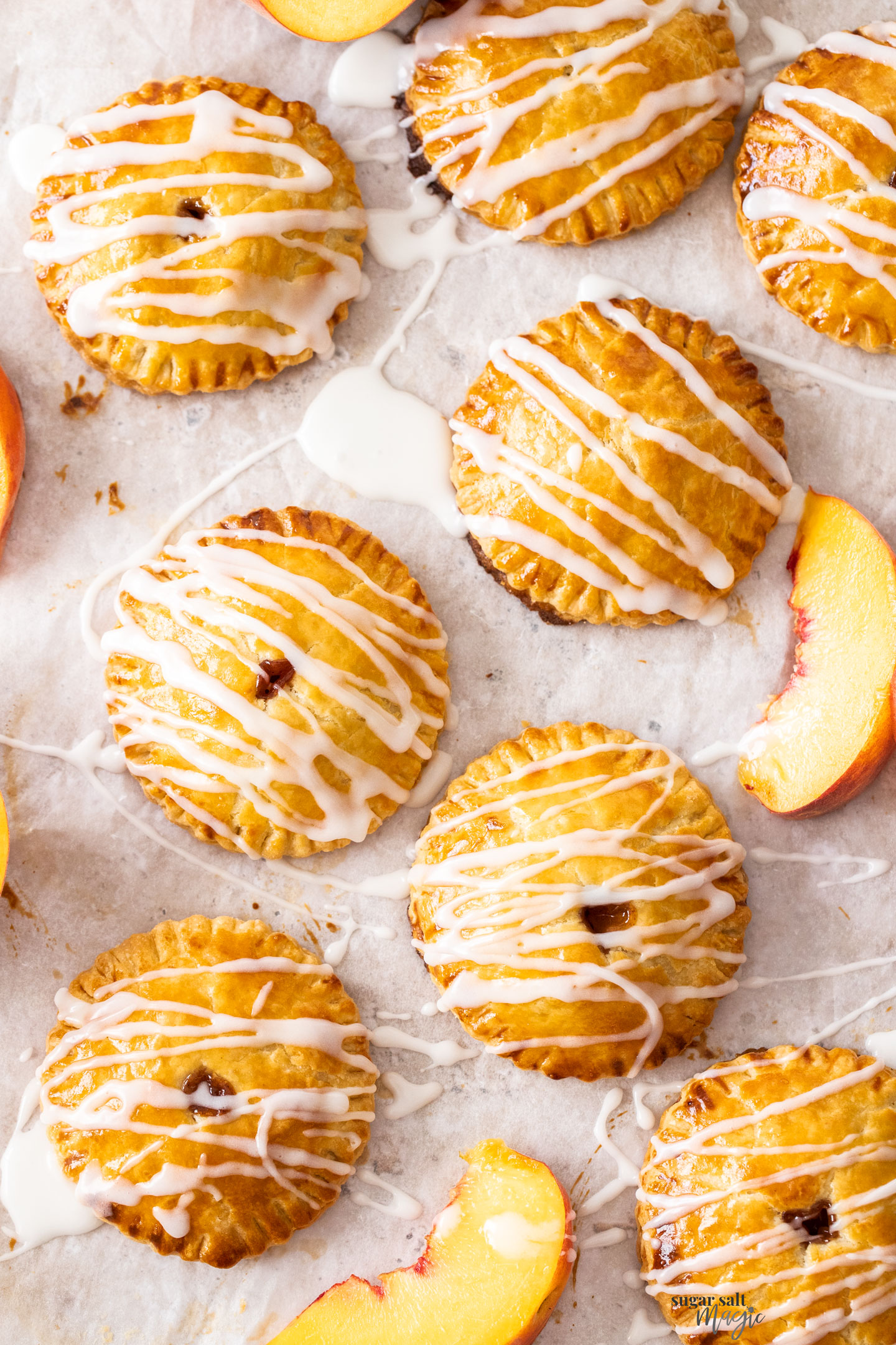 Top down view of round peach hand pies.