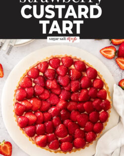 Top down view of a tart decoarated with fresh strawberries.