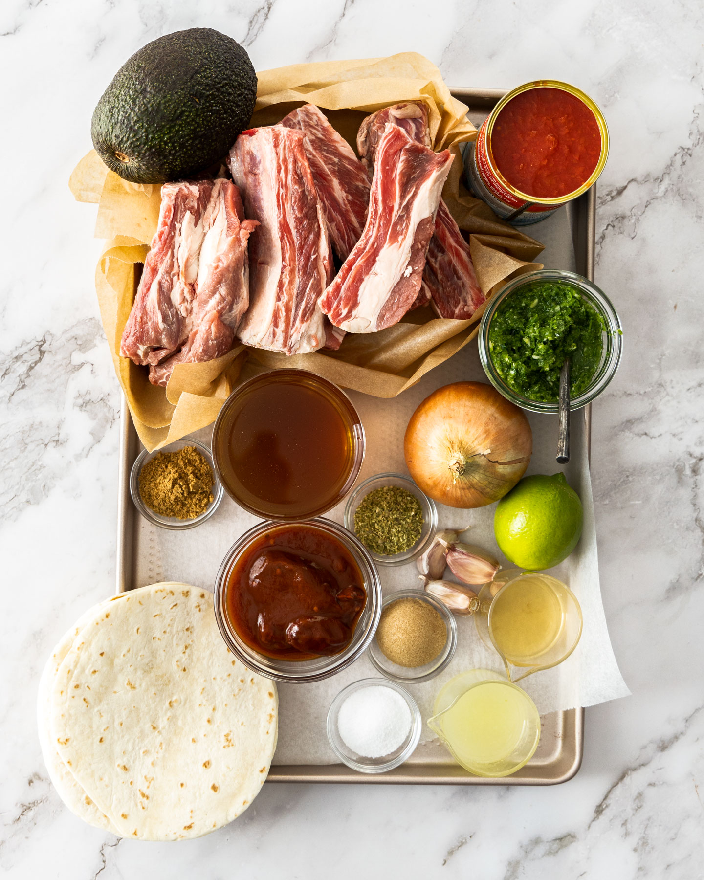 Ingredients for short rib tacos on a baking tray.