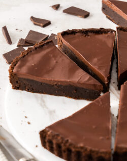 Close up of a slice of brownie tart.