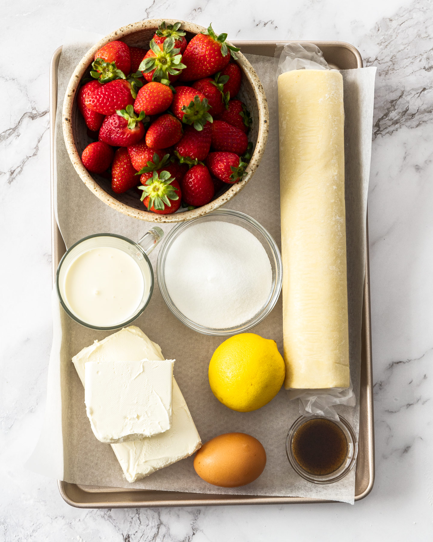 Ingredients for strawberry puff pastry tart.