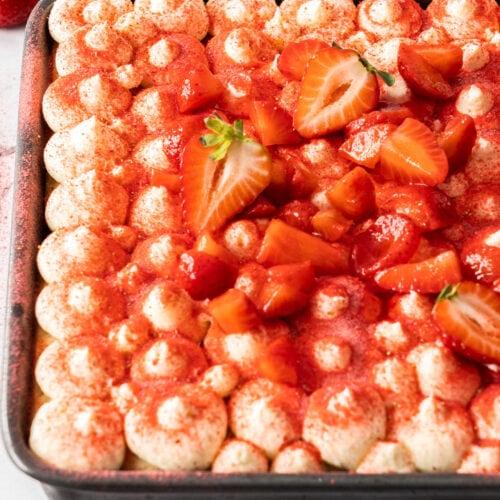 A whole strawberry tiramisu in a baking pan.