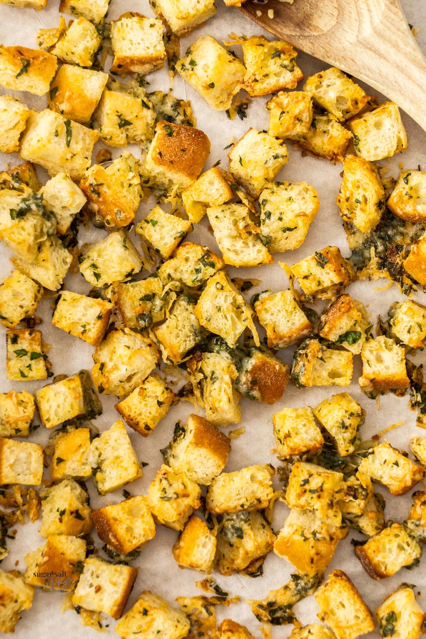 Close up of croutons on a baking tray.