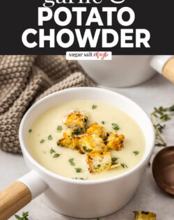 A soup bowl filled with potato chowder and croutons.