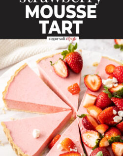 Slices of strawberry mousse tart on a marble platter.