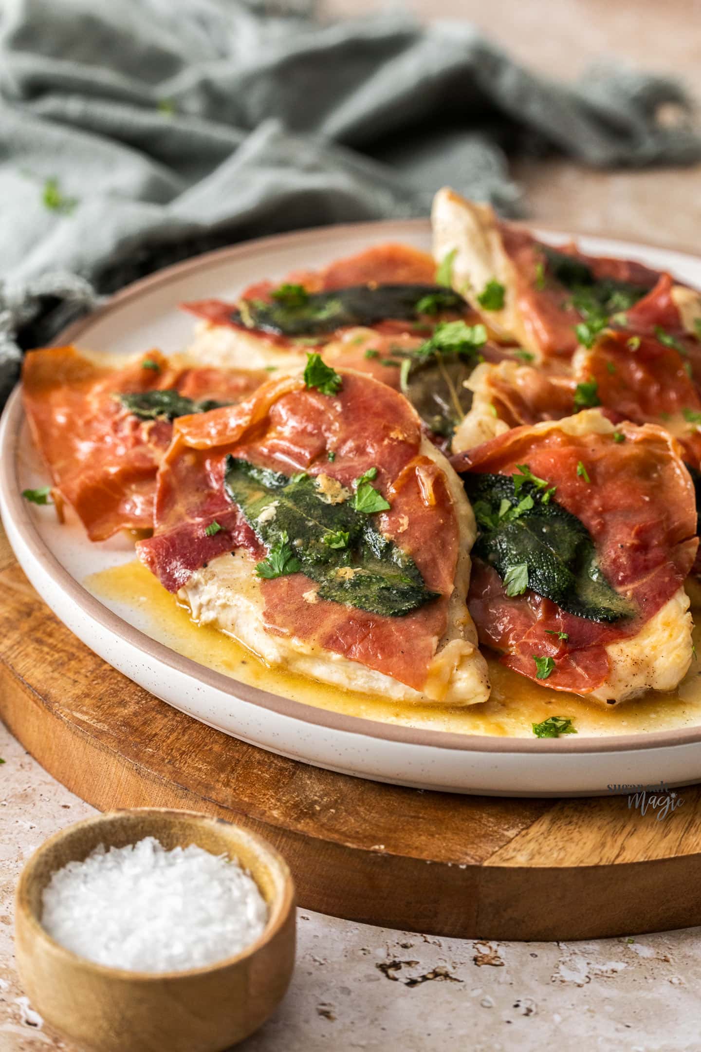 Slices of saltimbocca on a plate.